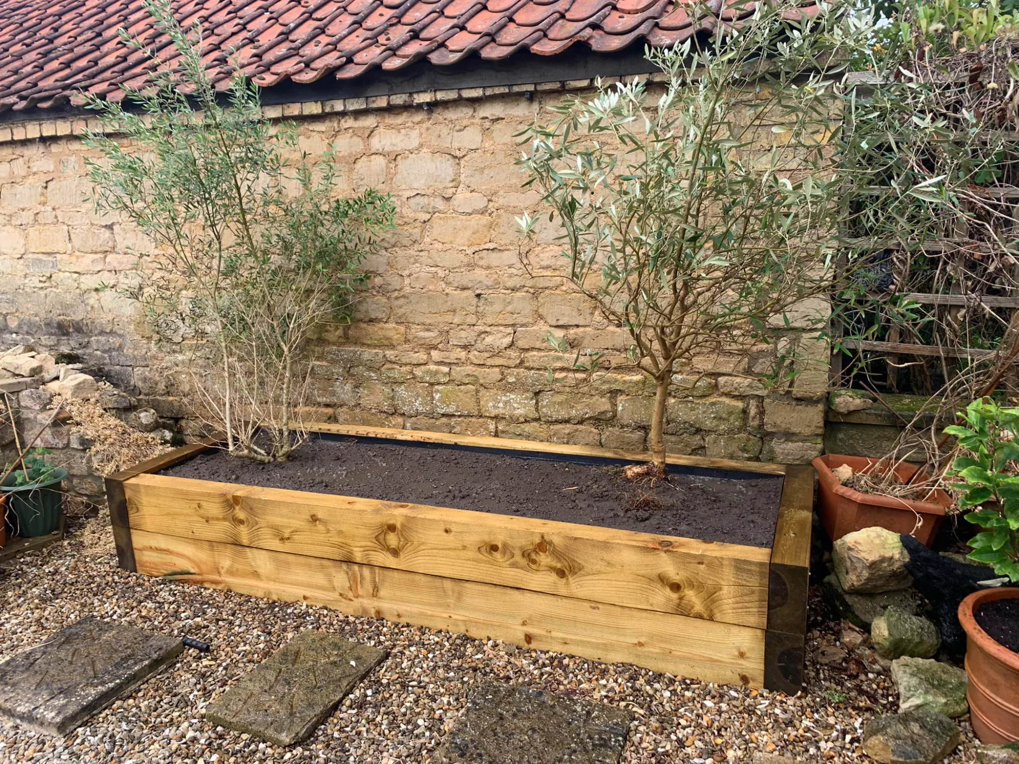 Professional fence installation with new and weathered panels